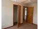 Spacious bedroom with closet and entry doors, and neutral colored carpet at 2730 Sw 173Rd Place Rd, Ocala, FL 34473