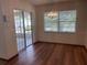 Dining area has a sliding door to the patio and a modern chandelier at 2730 Sw 173Rd Place Rd, Ocala, FL 34473