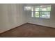 Dining room has a modern chandelier and a window to the backyard at 2730 Sw 173Rd Place Rd, Ocala, FL 34473