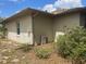 Exterior view of the house and yard with shrubs at 2730 Sw 173Rd Place Rd, Ocala, FL 34473