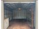 Spacious metal garage with workbench and ample storage space, perfect for projects and organization at 2730 Sw 173Rd Place Rd, Ocala, FL 34473