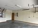 Well-lit garage interior showing the electrical panel, offering ample storage and potential workspace at 2730 Sw 173Rd Place Rd, Ocala, FL 34473