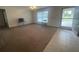 Cozy living room features carpet flooring, a window, and neutral walls at 2730 Sw 173Rd Place Rd, Ocala, FL 34473
