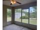 Screened in patio offering relaxing space with view of the yard at 2730 Sw 173Rd Place Rd, Ocala, FL 34473