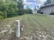 A verdant yard with a utility access point and spacious area at 2730 Sw 173Rd Place Rd, Ocala, FL 34473