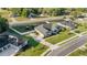 Aerial view of property featuring a screened in pool and spacious lawn in a residential area at 4020 Se 23Rd St, Ocala, FL 34471