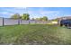 Expansive backyard with a well-maintained lawn and a modern fence for added privacy at 4020 Se 23Rd St, Ocala, FL 34471