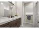 Bathroom featuring a vanity with a sink and a view of the shower at 4020 Se 23Rd St, Ocala, FL 34471