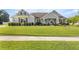 Charming home featuring a well-manicured lawn, a welcoming front porch, and complemented by lush landscaping at 4020 Se 23Rd St, Ocala, FL 34471
