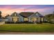 Charming single-story home featuring a well-manicured lawn and inviting front porch at 4020 Se 23Rd St, Ocala, FL 34471