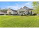 Charming single-story home featuring a well-manicured lawn and inviting front porch at 4020 Se 23Rd St, Ocala, FL 34471
