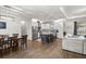 Open-concept kitchen featuring stainless steel appliances, granite countertops, and a center island at 4020 Se 23Rd St, Ocala, FL 34471