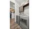Functional laundry room with modern appliances and convenient access to closet at 4020 Se 23Rd St, Ocala, FL 34471