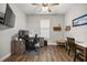 Well-lit office with wood floors, multiple workstations, and wall mounted monitor at 4020 Se 23Rd St, Ocala, FL 34471