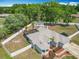 Aerial view of the home featuring a private backyard, screened-in pool, and fenced-in yard at 4033 Ne 15Th Court Rd, Ocala, FL 34479