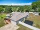 An aerial shot of the property, highlighting the house, yard, and shed at 4033 Ne 15Th Court Rd, Ocala, FL 34479