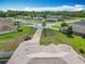 Aerial view of houses in a well-manicured neighborhood with lush landscaping at 4033 Ne 15Th Court Rd, Ocala, FL 34479