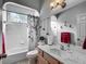 Well-lit bathroom with a shower-tub combo, ample counter space, and stylish fixtures creating a serene ambiance at 4033 Ne 15Th Court Rd, Ocala, FL 34479