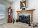 A cozy fireplace with a decorative mantel, complemented by a grandfather clock, and decorative items at 4033 Ne 15Th Court Rd, Ocala, FL 34479