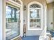Inviting front door and arch window with welcome sign adding charm to the home's entrance at 4033 Ne 15Th Court Rd, Ocala, FL 34479
