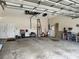 Spacious garage with an array of tools, shelving, and a rolling toolbox at 4033 Ne 15Th Court Rd, Ocala, FL 34479