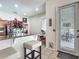 Bright kitchen area with bar seating and a door leading to the outside at 4033 Ne 15Th Court Rd, Ocala, FL 34479