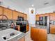 Traditional kitchen with granite countertops, stainless steel appliances, and a convenient center island at 4033 Ne 15Th Court Rd, Ocala, FL 34479
