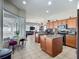 Open kitchen featuring an island, breakfast nook, and views into the living area, creating a seamless flow for entertaining at 4033 Ne 15Th Court Rd, Ocala, FL 34479