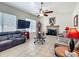 The living room features a fireplace, a large flat-screen TV, and comfortable seating at 4033 Ne 15Th Court Rd, Ocala, FL 34479