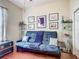 Living room featuring wood flooring, a sofa, display cases, and natural lighting at 4033 Ne 15Th Court Rd, Ocala, FL 34479