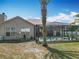Backyard view of screened-in pool with mature landscaping and a sunny Florida sky at 4033 Ne 15Th Court Rd, Ocala, FL 34479