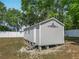 Exterior view of shed with white trim and a decorative accent at 4033 Ne 15Th Court Rd, Ocala, FL 34479