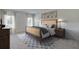 Comfortable bedroom with a plush bed, patterned rug and natural light at 4188 Sw 53Rd Lane Rd, Ocala, FL 34474