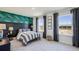 Bedroom with large window, striking wallpaper, and modern furnishings at 4196 Sw 53Rd Lane Rd, Ocala, FL 34474