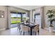 Elegant dining room with stylish decor, modern chairs, a contemporary table setting, and a sliding glass door to the backyard at 4196 Sw 53Rd Lane Rd, Ocala, FL 34474