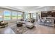 Inviting living room seamlessly connects to the kitchen and dining areas, featuring modern furniture and scenic backyard views at 4196 Sw 53Rd Lane Rd, Ocala, FL 34474