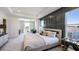Spacious main bedroom featuring a tray ceiling, modern decor, large windows, and an adjoining sitting area at 4196 Sw 53Rd Lane Rd, Ocala, FL 34474