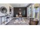 Stylish home office with a statement wall, modern decor, and plenty of natural light from the large windows at 4196 Sw 53Rd Lane Rd, Ocala, FL 34474
