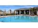 Community pool has lounge chairs, a covered patio, and landscaped areas for a resort-like feel at 4251 Sw 53Rd Lane Rd, Ocala, FL 34474