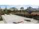 Community playground features a cornhole game area, modern playground equipment, and fenced perimeter at 4251 Sw 53Rd Lane Rd, Ocala, FL 34474