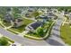 This aerial showcases the neighborhood, home, landscaping, backyard, and screened pool at 4398 Ne 29Th St, Ocala, FL 34470
