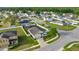 This aerial showcases the neighborhood, home, landscaping, backyard, and screened pool at 4398 Ne 29Th St, Ocala, FL 34470