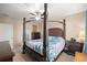 Bedroom showcasing a canopy bed and dresser, offering a comfortable and stylish retreat at 4398 Ne 29Th St, Ocala, FL 34470