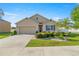 Charming single-story home featuring a well-manicured lawn and beautiful landscaping at 4398 Ne 29Th St, Ocala, FL 34470