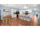 Spacious kitchen with center island, bar seating, and modern appliances at 4398 Ne 29Th St, Ocala, FL 34470