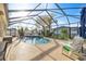 Screened in pool area featuring a private pool and plenty of seating at 4398 Ne 29Th St, Ocala, FL 34470