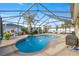 Private pool area with a waterfall feature, lounge chairs, and tropical landscaping at 4398 Ne 29Th St, Ocala, FL 34470