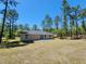 Spacious backyard of the home, ideal for outdoor activities and relaxation at 441 Nw Buena Vista Rd, Dunnellon, FL 34431