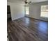 Bright bedroom with natural light, wood-look floors, and a ceiling fan at 441 Nw Buena Vista Rd, Dunnellon, FL 34431