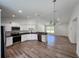 Open kitchen featuring stainless appliances, granite counters, and ample cabinet space at 441 Nw Buena Vista Rd, Dunnellon, FL 34431